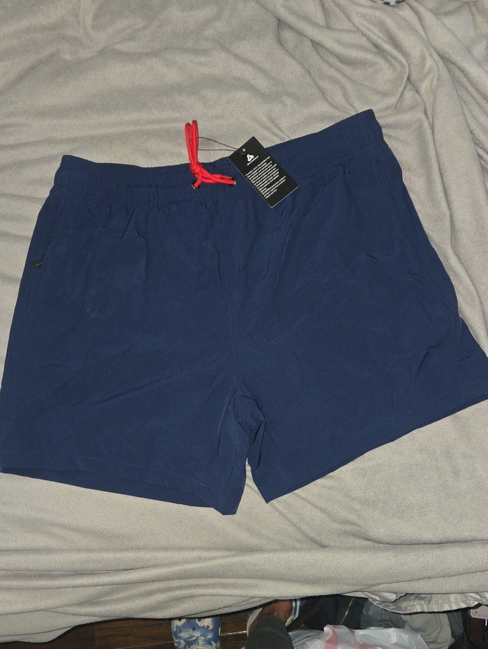 Navy Blue Swim/Active Shorts with Red Drawstring And Compression Lining.
